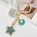 Gold Tone Seashell Starfish Charm Keychain With Faux Pearl view 2