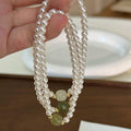 White Pearl Stretch Bracelet Green Jade Center Bead view 1