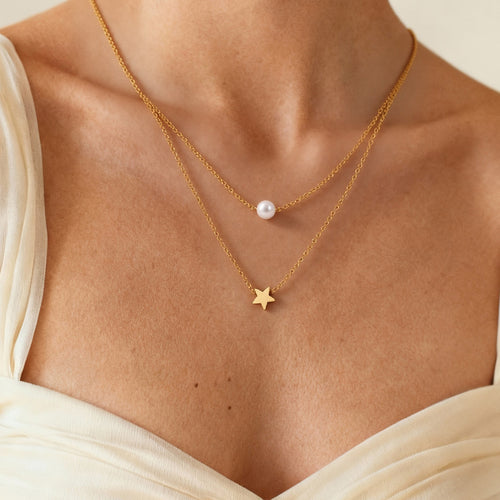 Neckline view of beaded double layer star necklaces in main image 2.