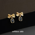 Gold Tone Textured Bow And Black Rectangular Stone Drop Earrings view 1