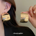 Wide Curved Hoop Earrings with Polished Gold and Silver Finish view 2