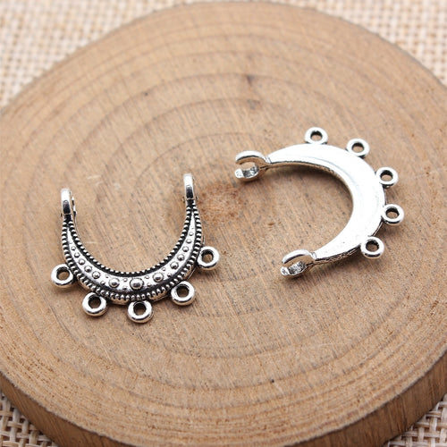Five Loop Crescent Metal Earring Connectors wood display of first finish