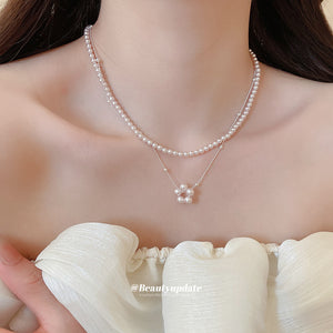 Layered White Pearl Necklace with Round Floral Pendant