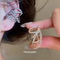 Crisscross Crystal Ear Clips in Silver and Gold Tones view 1