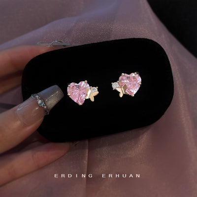 Gold-tone pink-heart-stone butterfly studs in the first product display.
