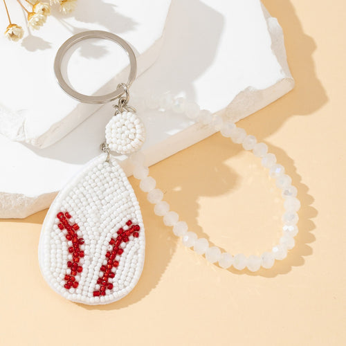 Baseball charm keychain shown with its matching crystal bead bracelet