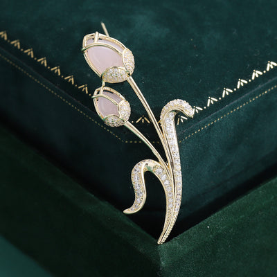 Pink Crystal Tulip Stem Brooch With Curved Sparkling Leaves shown from the front on a white background