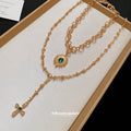 Layered Gold Tone Cross and Green Gem Pendant Necklace view 2