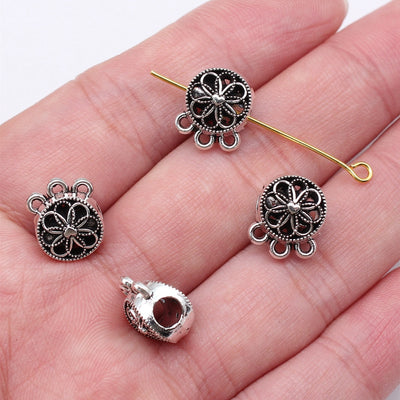 Floral Three Way Pendant Bail Bead in Antique Silver shown in image 1, highlighting a four-petal face, top threading hol
