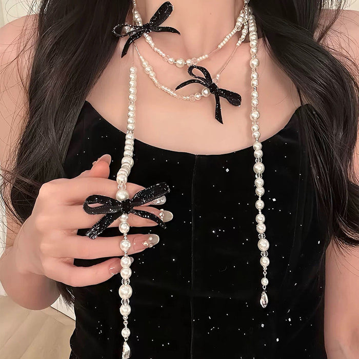 Long Pearl Tassel Necklace With Crystal Bow Accents