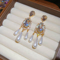 Gold Tone Teardrop Crystal Earrings With Pearl Tassels view 6