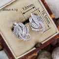 Layered Leaf And Baguette Clear Stone Stud Earrings Silver Tone view 4
