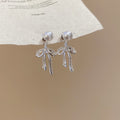 Silver Bow Pearl Fringe Stud Earrings with Polished Metal Details view 6