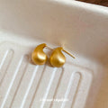 Brushed Gold Tone Curved Teardrop Stud Earrings With Decorative Metal Accents view 4
