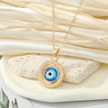 Gold Tone Blue Evil Eye and Hamsa Hand Pendant Necklaces view 6