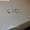Two Silver Tone Open Rings With Overlapping Crystal Bands view 3