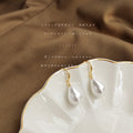 Gold Tone White Pearlescent Teardrop Hook Earrings For Women view 4
