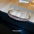 Raised Flower Crystal Hinged Bangle In Gold Tone Or Silver Tone view 4