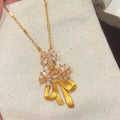Gold Tone Crystal Flower Necklace With Amber Color Drop Charms view 6