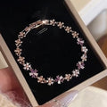 Rose Gold Flower Pearl Clasp Bracelet Purple Crystal Accents view 1