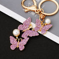 Three Butterfly Drop Keychains in Pink Yellow Purple and White Crystal Palettes view 4