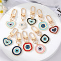 Gold Tone Layered Round Heart and Lash Evil Eye Clip Keychains view 1