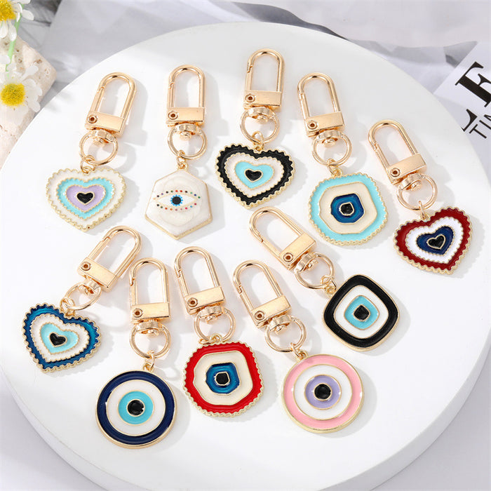 Gold Tone Layered Round Heart and Lash Evil Eye Clip Keychains