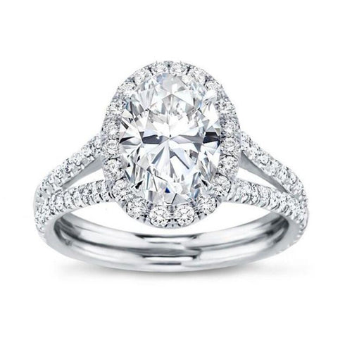 Silver oval halo clear CZ ring product shot on white