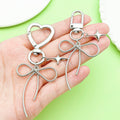 Butterfly Charm Keychains Featuring Silver Bow Across 8 Pictured Variations view 2