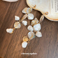 Gold Tone Long Drop Earrings With Irregular Shell Like Pieces view 4