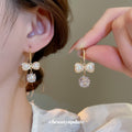 Gold Bow Heart And Pearl Hook Earrings Statement Pair view 2