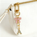 Gold Tone Initial Letter Keychain With Pink Enamel Bow Charm view 6