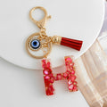 Red Resin Shell Letter Keychain with Evil Eye and Tassel view 12