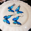 Blue Butterfly Drop Earrings in Clip On and Hook Styles view 2