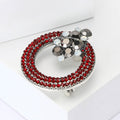 Crystal Wreath Brooch in Metal with Circular Crystal Rows Topped by a Floral Cluster view 3