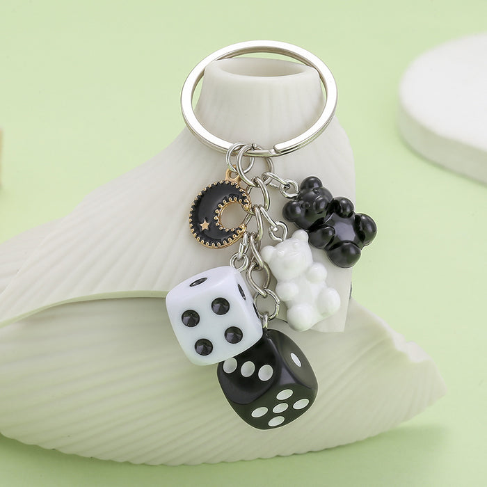 Dice Charm Keychains Featuring Black Moon Across 10 Pictured Variations