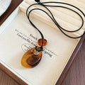 Translucent Teardrop Pendant Cord Necklaces in Three Colors view 7