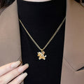 Gold Crystal Pony Pendant Necklace and Stud Earrings view 2