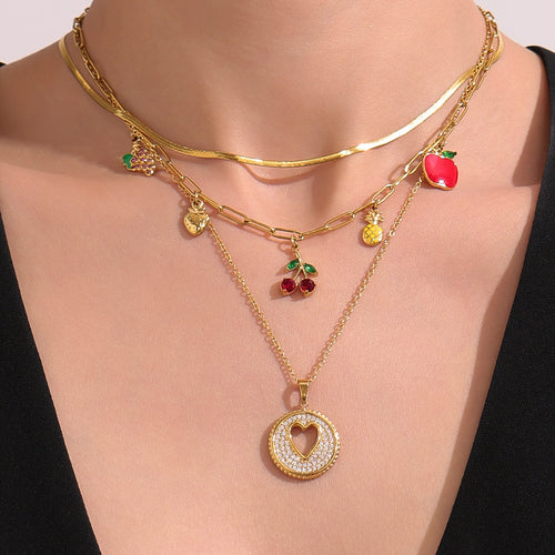 Display view of fruit charm and heart pendant necklaces in main image 2.