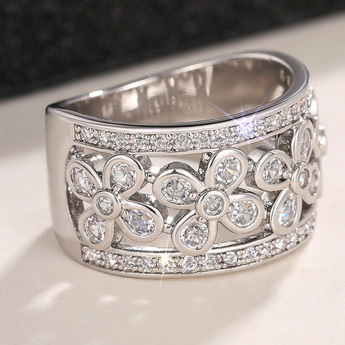 Second product view showing silver-tone five-petal floral openwork extra-wide ring