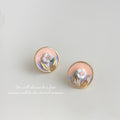 Gold Tone Peach Round Disc White Flower And Green Leaf Stud Earrings view 1