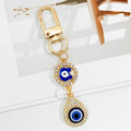 Gold Crystal Evil Eye Keychain With Butterfly And Bear Charm view 6