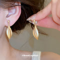 Matte Leaf Drop Clip Earrings in Gold and Silver Tones view 3