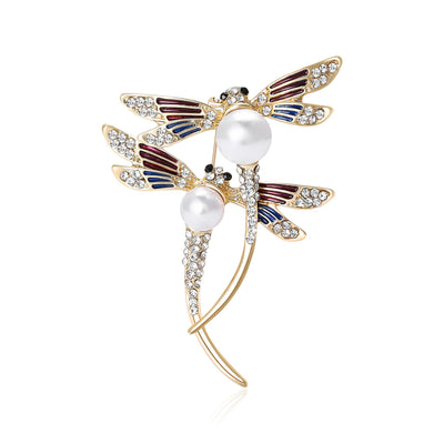 Front view showing the double dragonfly brooch with crystal wings and faux pearls