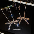 Crystal Bow Pendant Necklaces in Gold and Silver Tones view 4