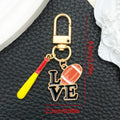 Badminton Racket and Mixed Sports Metal Clasp Keychain Set view 7