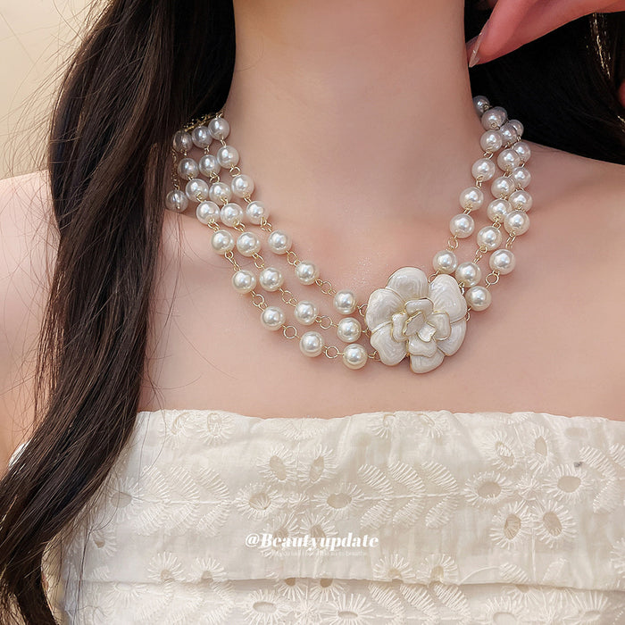 Layered Faux Pearl Necklace with White Floral Centerpiece