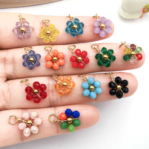 Gold-tone bead and daisy charms shown in a close-up product view