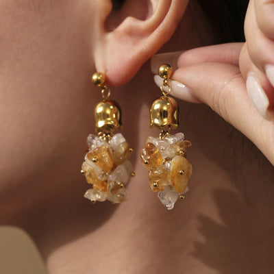 Yellow crystal chip cluster earrings worn on ear