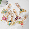 Gold Tone Butterfly and Fishtail Pressed Flower Clip Keychains view 1